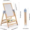 A wooden easel for children with a whiteboard and tray of art supplies, shown in both upright and folded positions with dimensions indicated. Voir les images du produit