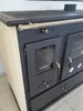 A close-up, front-facing view of a black and cream wood-burning stove with a silver handle and glass doors. Produktbild-Vorschau