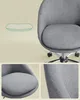 Close-ups of a gray office chair, including a diagram of its cushioning. Náhled obrázku produktu