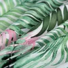 A close-up view of fabric with a green and pink floral pattern. Náhled obrázku produktu