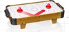 A miniature air hockey table with dimensions indicated by measurement lines. Anteprima dell’immagine prodotto