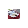 A suitcase with clothes and a travel iron. Produktbild-Vorschau