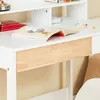 A close-up view of a white desk with a wooden drawer front, showing an open book and some colored pencils. Podgląd zdjęcia produktu