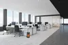 A modern office space with desks, computers, and chairs, featuring a small portable heater. Produktbild-Vorschau