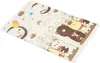 A folded baby play mat with cartoon animal illustrations. Produktbild-Vorschau