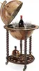 A globe bar with bottles and glasses inside. Produktbild-Vorschau
