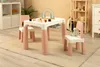 A child's table and chairs set in a room. Produktbild-Vorschau