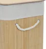 A close-up view of a bamboo laundry basket with a rope handle and a fabric liner. Podgląd zdjęcia produktu