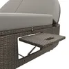 A close-up view of a section of a rattan outdoor lounger, showing a pull-out tray with a cup holder. Podgląd zdjęcia produktu