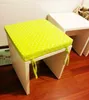 Two white stools with green polka dot cushions are shown on a wooden floor. Produktbild-Vorschau