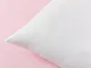 A white pillow is shown on a pink background. Produktbild-Vorschau