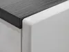 Close-up of the corner of a furniture piece, showing the junction of a dark wood-grain top and a white side. Produktbild-Vorschau
