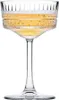 A single champagne coupe glass filled with a golden beverage, presented on a white background. Náhľad obrázku produktu