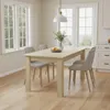 A dining room with a table and chairs, set near a window. Voir les images du produit