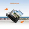 A dashcam is shown with multiple screens displaying recorded footage, suggesting loop recording functionality. The background depicts a seaside scene with a road in the foreground. Produktbild-Vorschau
