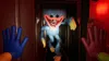 A scary blue monster with sharp teeth and yellow hands is shown in a dark hallway with red lighting. Produktbild-Vorschau