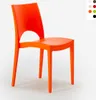 An orange chair is shown against a white background. Voir les images du produit