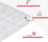 A close-up of a white mattress topper with quilted stitching. Produktbild-Vorschau
