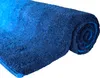 A rolled-up blue bath mat on a white background. Podgląd zdjęcia produktu