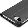 Close-up view of a black flip phone case, showing the stitching and the camera cutout. Náhled obrázku produktu