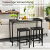 A bar table and two bar stools are set up in a living room next to a sofa, with drinks and snacks on the table. Anteprima dell’immagine prodotto