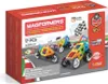 The image shows the packaging of a MAGFORMERS construction set, featuring colorful magnetic building pieces forming toy vehicles on a race track background. Náhled obrázku produktu