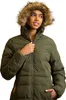 A woman wearing a green puffer jacket with a fur-lined hood. Voir les images du produit