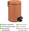 A terracotta colored pedal bin with black accents, shown against a white background. Text describing features is present below the bin. Náhled obrázku produktu