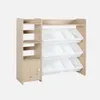 A wooden toy storage unit with multiple white bins and shelves, presented against a plain white background. Produktbild-Vorschau