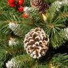 A close-up view of artificial Christmas decorations, including pinecones, berries, and pine needles. Anteprima dell’immagine prodotto