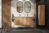 A modern bathroom with a wooden vanity, tropical wallpaper, and a tall cabinet. Produktbild-Vorschau