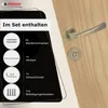 A door handle set and its included components are displayed on a wooden door. Produktbild-Vorschau