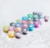 A collection of numbered paint pots arranged on a canvas with a numbered outline. Produktbild-Vorschau