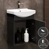 A bathroom vanity with a sink and cabinet, featuring toiletries inside the open cabinet. Produktbild-Vorschau