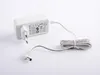 A white power adapter with a white cable and a DC barrel connector is shown on a white background. Produktbild-Vorschau