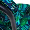 A close-up view of a cushion with a tropical leaf pattern. Produktbild-Vorschau