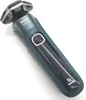 A teal and gray electric shaver is shown against a white background. Produktbild-Vorschau