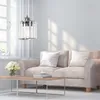 A living room scene with a sofa, coffee table, and a pendant light. Produktbild-Vorschau