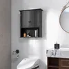 A black wall-mounted cabinet with two doors and an open shelf below, shown in a bathroom setting with white subway tiles. Podgląd zdjęcia produktu