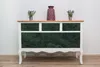 A dresser with green marble-patterned drawers and a wooden top, decorated with two small potted plants and a vase. Náhľad obrázku produktu