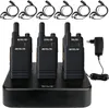 A set of six Retevis walkie-talkies are neatly arranged on a black charging base, with individual charging cables and a power adapter visible. Náhled obrázku produktu