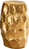 A gold-colored metallic stool with a hammered, honeycomb-like texture. Produktbild-Vorschau