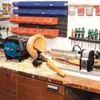 A woodworking workshop with a lathe and tools on a workbench. Podgląd zdjęcia produktu