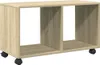 A light brown wooden storage unit with two open compartments and wheels. Náhled obrázku produktu