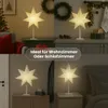 Collage of four images showing a star-shaped lamp in different room settings, with text overlay. Podgląd zdjęcia produktu