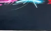 A close-up view of the edge of a dark-colored gaming mat with neon-colored abstract designs at the top. Produktbild-Vorschau