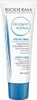 A white tube of Bioderma Atoderm Nutritive cream with blue accents and text. Podgląd zdjęcia produktu