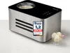 A stainless steel ice cream maker with a black top, placed on a white surface with a light gray background. A small bowl of ice cream with a flower is next to it. Produktbild-Vorschau