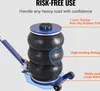 A close-up marketing image of a triple bag air jack with feature callouts. Voir les images du produit