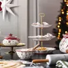A festive Christmas-themed table setting with cookies and baking items. Anteprima dell’immagine prodotto